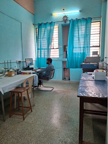 Research Centre T-205, a researcher at a workstation with lab equipment