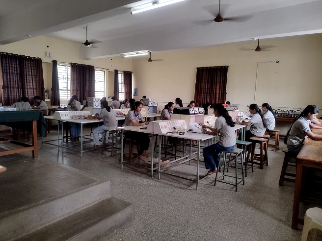 Physics Lab-II T-307, students at benches during a practical session