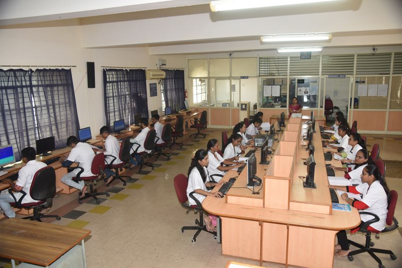 Students at workstations in a computer lab