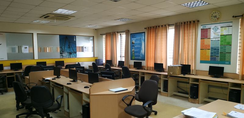 Rows of workstations in a computer lab, set out for an examination