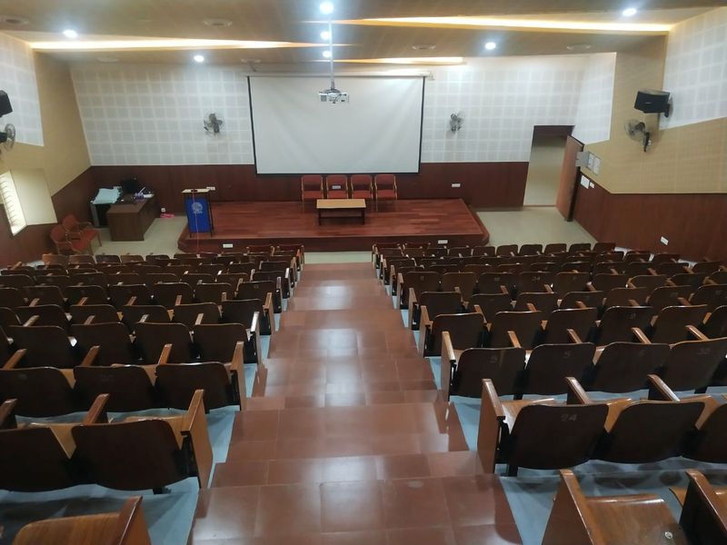 The placement seminar hall, tiered seating facing a projector screen and podium